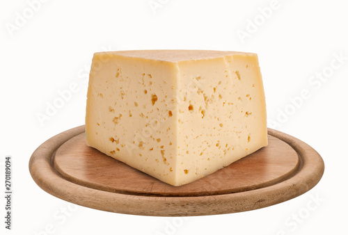 Piece of asiago cheese shape on round wooden plate, isolated on white