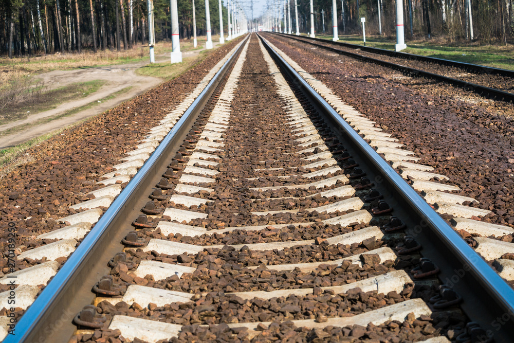 Modern high-speed railway.Railroad tracks.Railway track covered with gravel.Eastern Europe Modern high-speed railway.Railroad tracks.Railway track covered with gravel.Eastern Europe