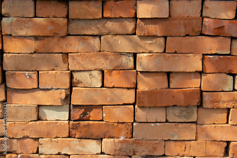 Red brick stack, background texture pattern. A pile of bricks material for construction. Red brick stack, background texture pattern. A pile of bricks material for construction.
