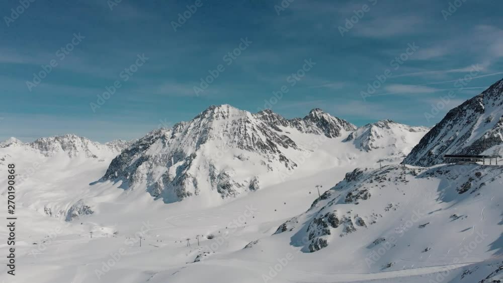ski resort, elevator track for movement of skiers tourists on snowy mountains against blu sky ski resort, elevator track for movement of skiers tourists on snowy mountains against blu sky