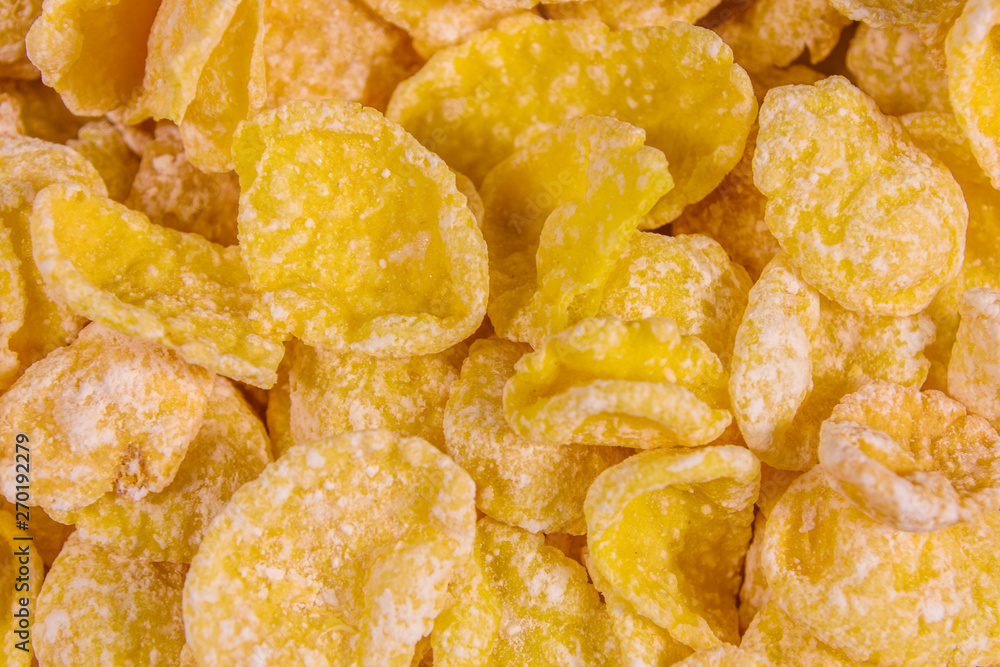 Background of the many yellow cornflakes. Healthy eating Background of the many yellow cornflakes. Healthy eating