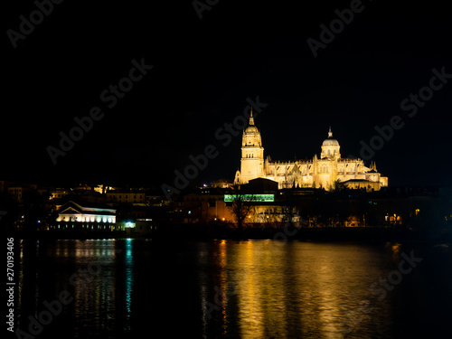 Long exposure night view of the Cathedral and Enrique Estevan bridge in Salamanca (Spain)