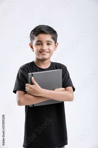 little Indian / Asian boy with note book