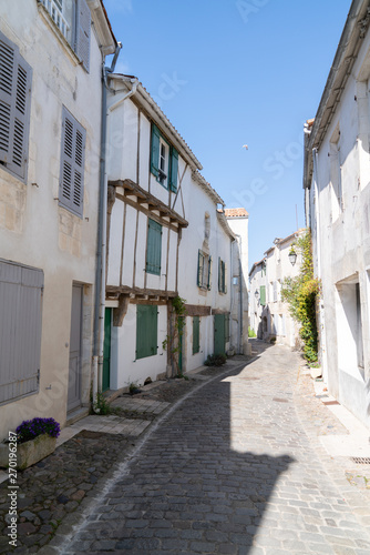 antique french cobblestone street in Saint Martin de Re, France © OceanProd