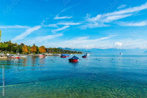 Lake geneva with Boats and Mountain in Switzerland.