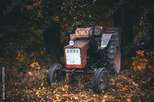 abandoned old tractor staying in the backyard