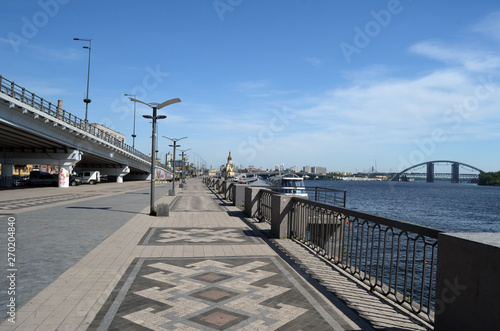 Embankment and river-boats early morning at spring. Downtown. Kiev Ukraine