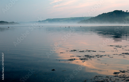 Dawn mist over Slapton Ley, south Devon, England, UK.