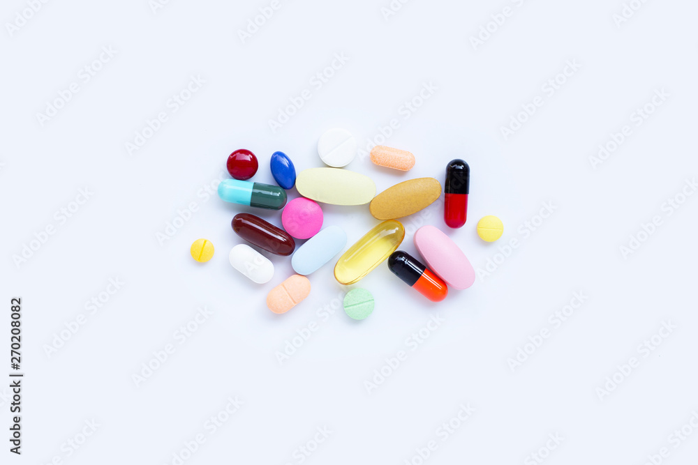 Colorful tablets with capsules and pills on white. Colorful tablets with capsules and pills on white.