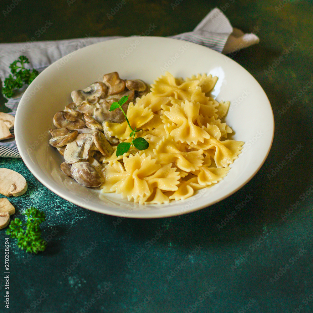 pasta Farfalle with mushrooms, cream sauce and cheese (main dish) snack. food background. top