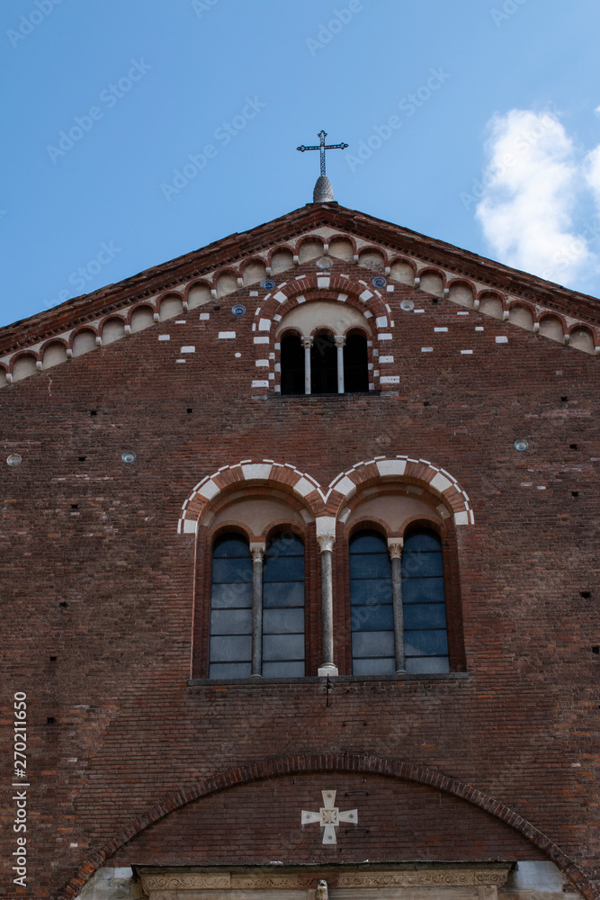 Milan, Italy, Europe: the exterior of the Basilica of San Simpliciano, the second oldest church in the form of a Latin cross, first erected by Saint Ambrose, part of a convent with a great cloister