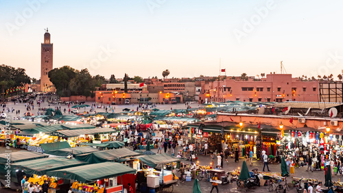 MARRAKECH, MOROCCO - MAY 15 2019: Djemaa El-fna at Marrakech, Morocco. Top view of the UNESCO square on ramadan kareem on sunset photo