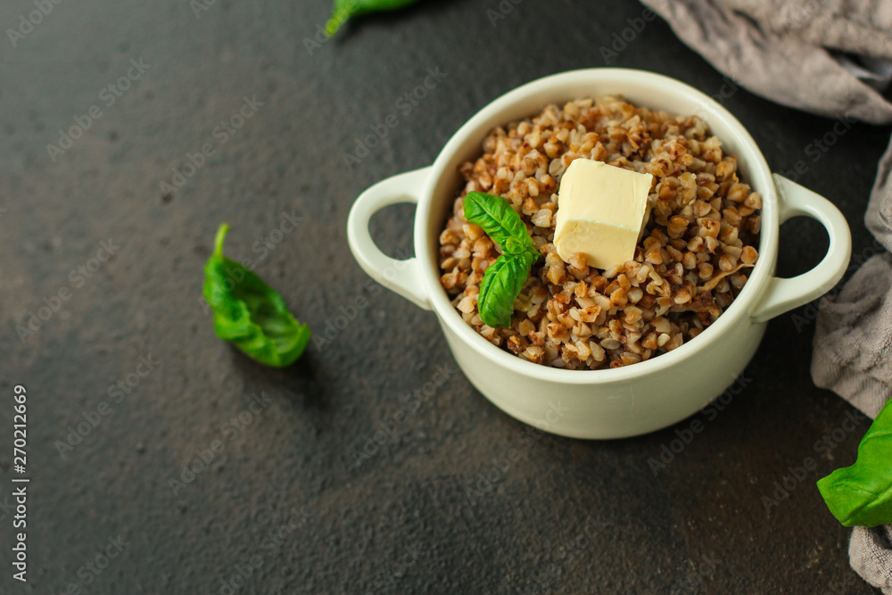 buckwheat porridge and a piece of butter (delicious food) homemade dish. food background. top buckwheat porridge and a piece of butter (delicious food) homemade dish. food background. top