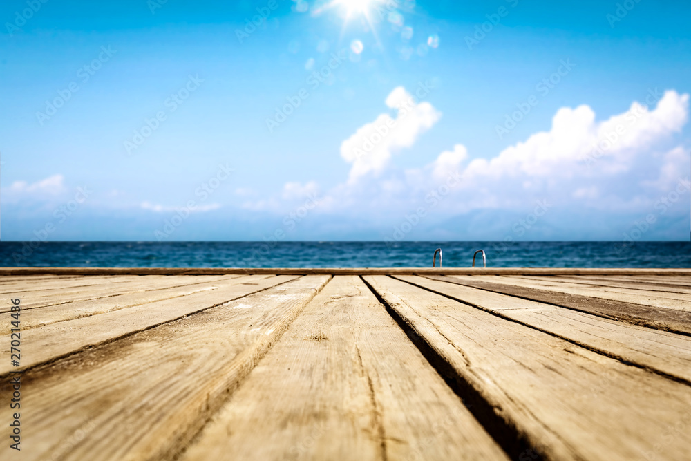 Summer wooden pier of free space for your deoration and ocean landscape with sun light. 