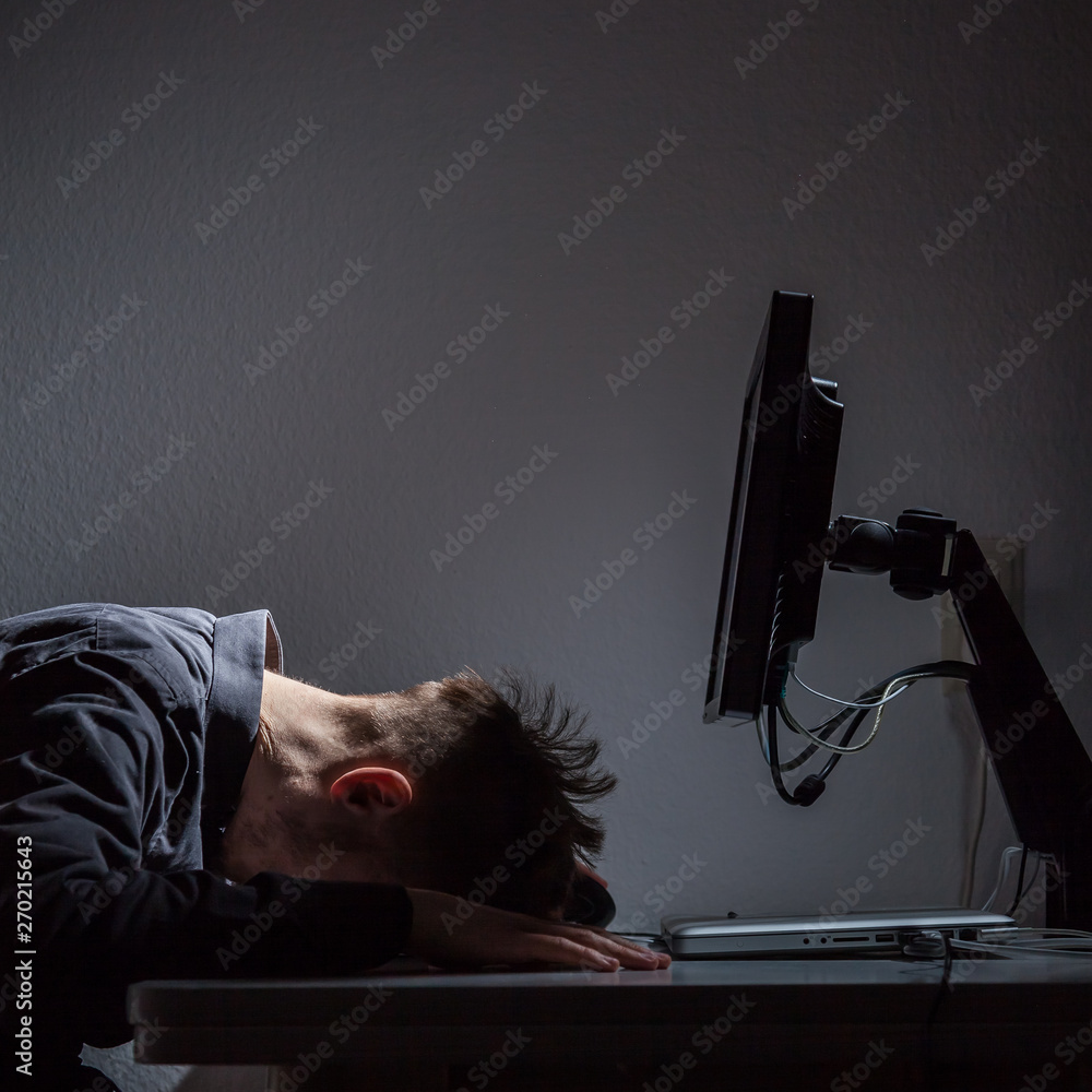 Fototapeta premium Office Worker resting his head on the table