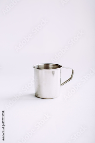 metal mug on a white background, copy space