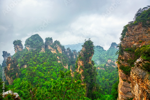 Zhangjiajie National park. Famous tourist attraction in Wulingyuan  Hunan  China. Amazing natural landscape with stone pillars quartz mountains in fog and clouds