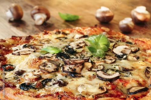 Homemade Mushroom Pizza with Basil Leaves and Olives