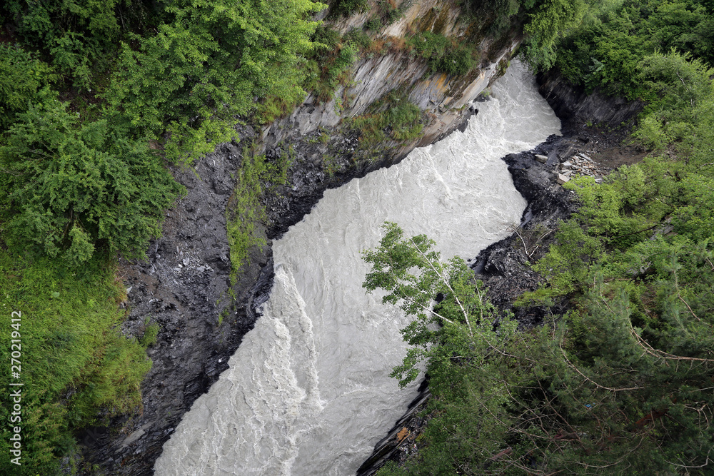 Obraz premium Mountain river in a narrow gorge in Georgia