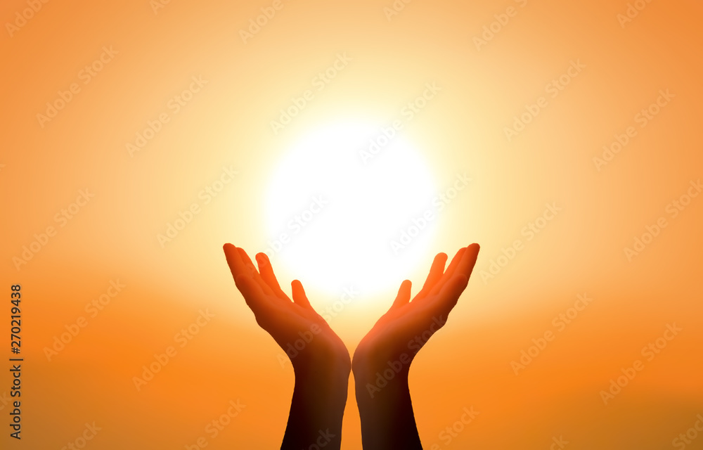 Hand Rises From Sun For Help Free concept: Raised hands catching sun on sunset sky Stock Photo ...
