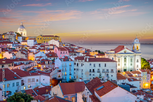 skyline of alfama at lisbon, portugal at dawn photo