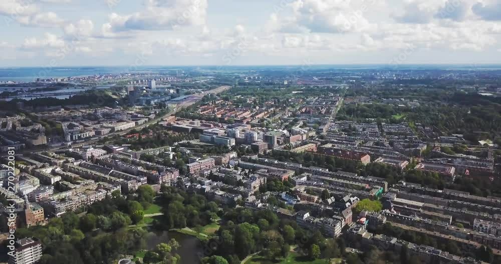 Aerial push shot over Amsterdam park, wide view of city with copy space Aerial push shot over Amsterdam park, wide view of city with copy space