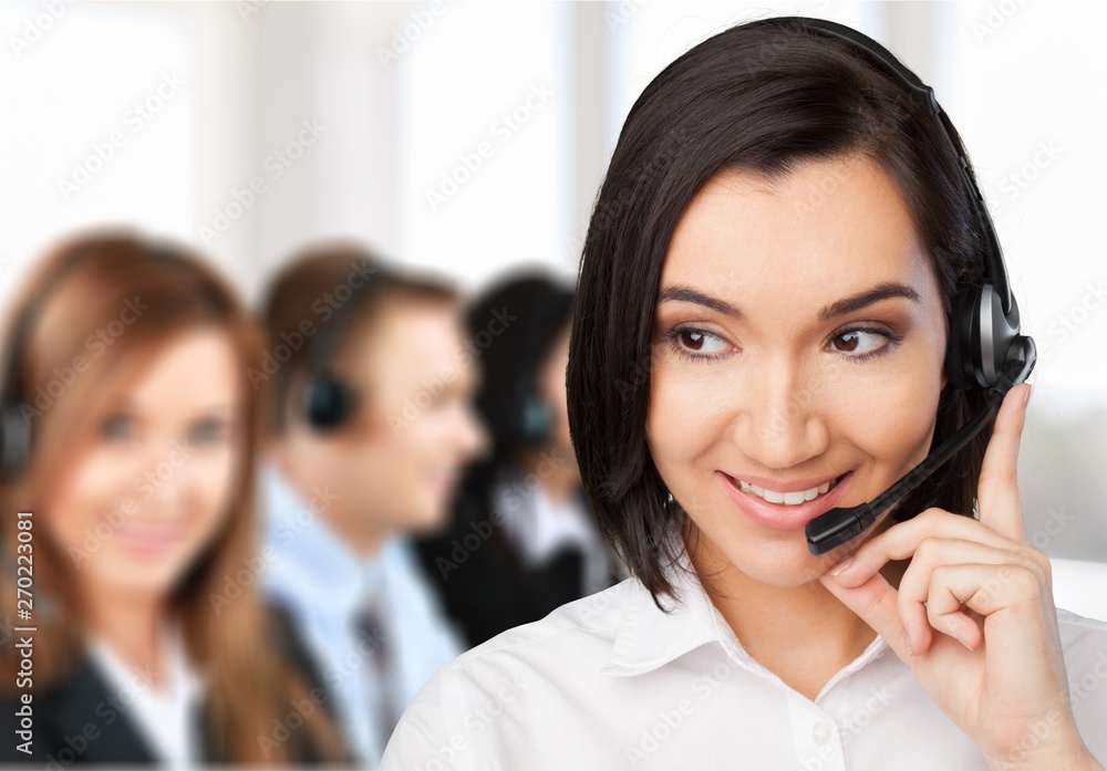 Young woman with headphones, call center or support concept Young woman with headphones, call center or support concept