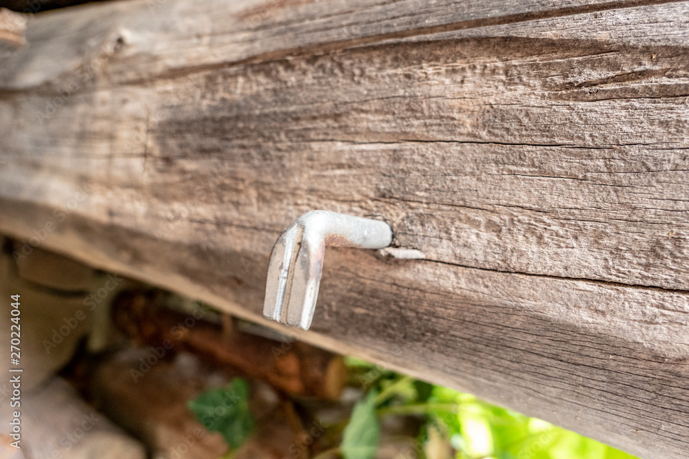 Hook in an old wooden beam macro Hook in an old wooden beam macro