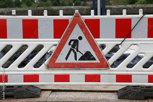 Fencing on the road due to construction photo