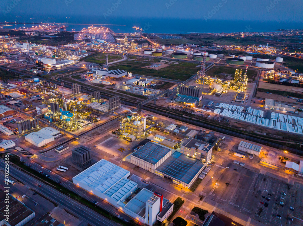 Night aerial view of chemical plant next to Salou