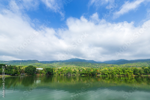 Mountain range forest with the reservoir blue sky background in Ang Kaew Chiang Mai University,Thailand.