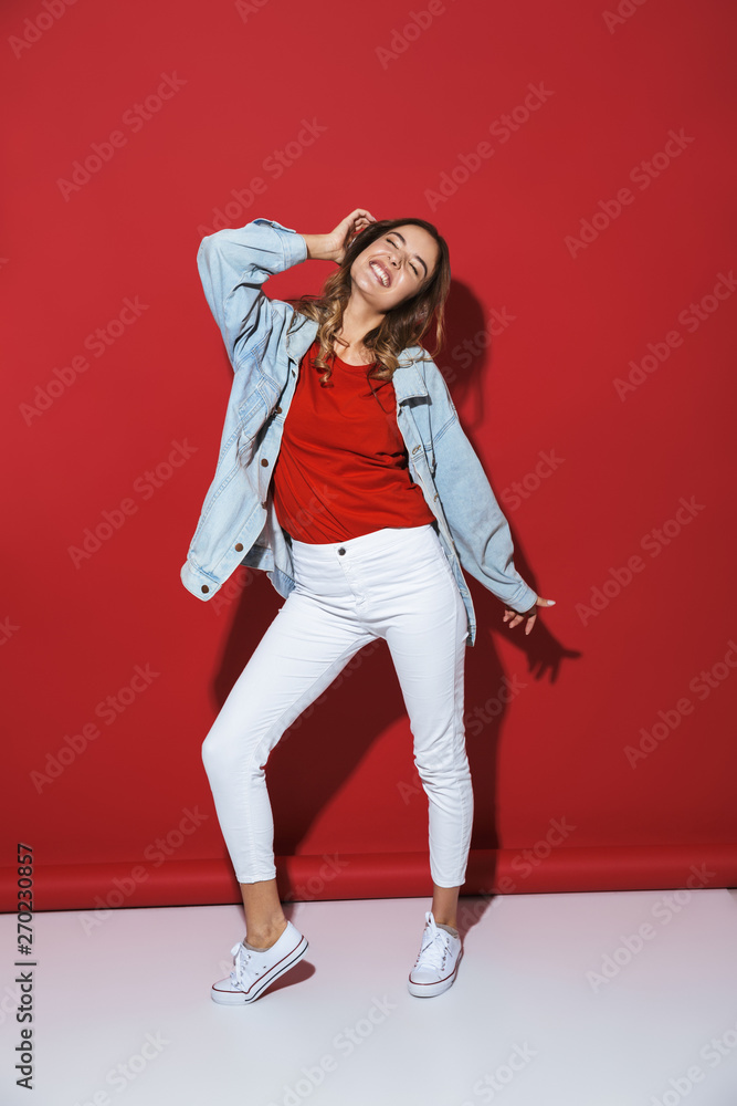 Full length portrait of a cheerful stylish young woman Full length portrait of a cheerful stylish young woman