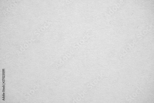 Abstract white recycled paper texture background or backdrop. Empty old cardboard or recycling paperboard for design element. Simple gray grainy surface for journal template presentation.