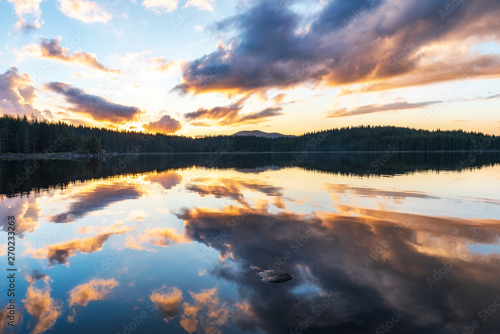 Stunning image of the foggy lake Shiroka poliana in Rhodope mountain, Bulgaria, Europe. Dramatic evening sunset scene. 