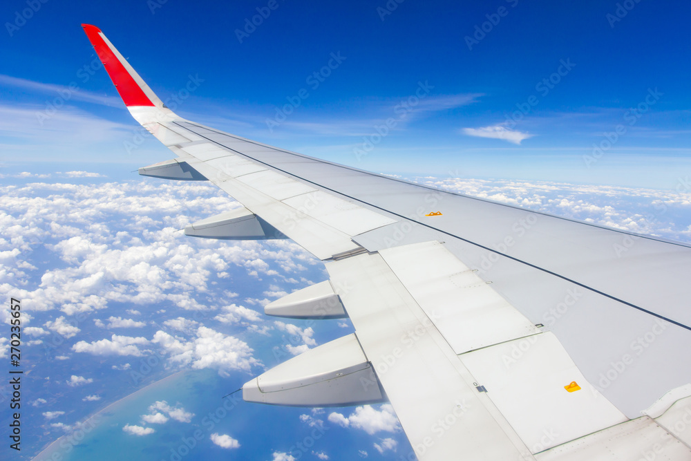 Sky wings and white clouds flying over Phuket, Thailand