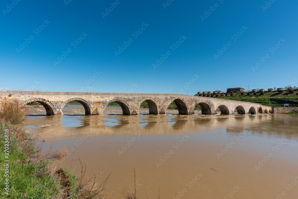 Old historic bridge over the Euphrates River.  Turkey.