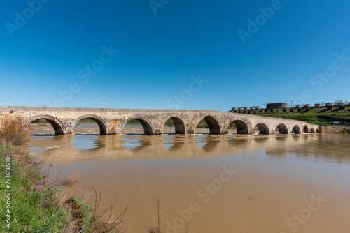 Old historic bridge over the Euphrates River. Turkey.