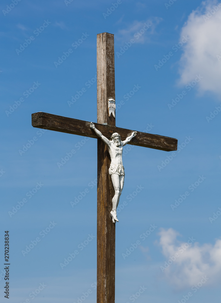 The image of a symbol of Jesus Christ on a wooden cross