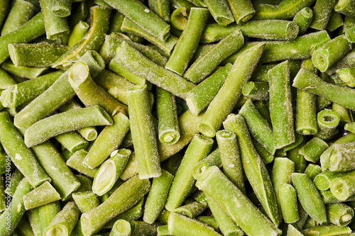 Chopped green bean pods, covered with ice
