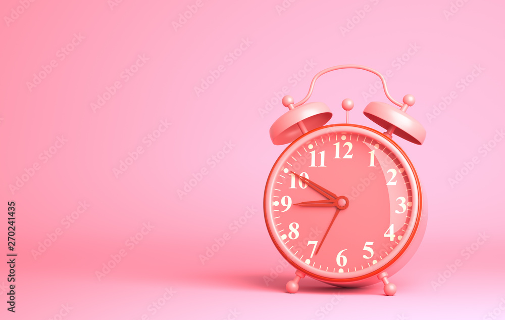 Alarm clock on the pink background Alarm clock on the pink background
