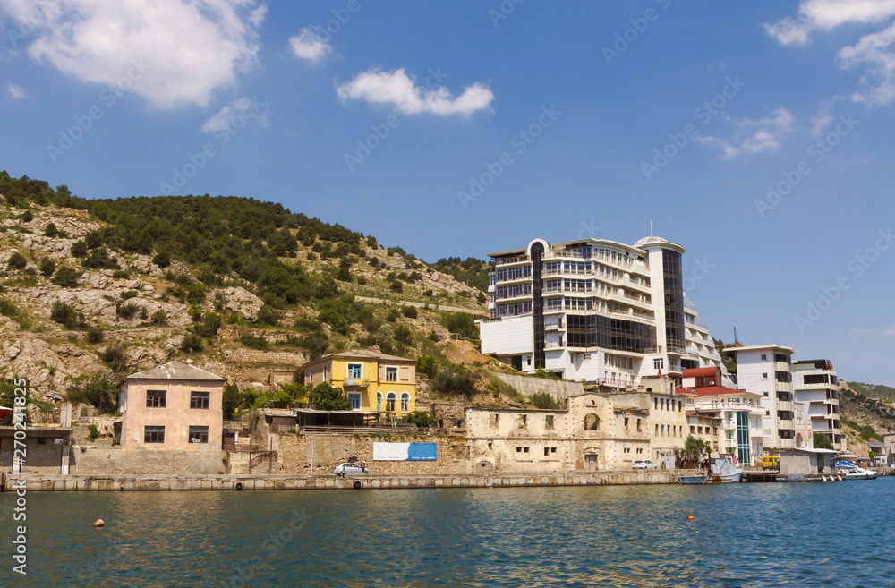 Old and new buildings on the banks of the picturesque Balaklava Bay in the Crimea.