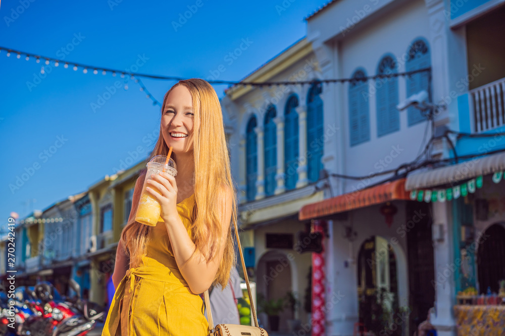 Woman tourist on the Street in the Portugese style Romani in Phuket Town. Also called Chinatown or the old town
