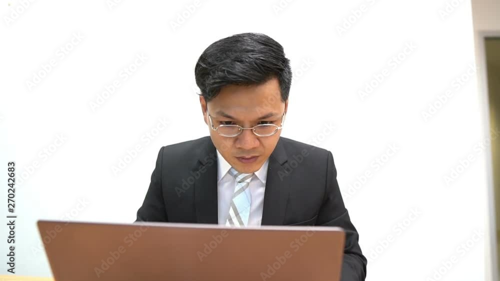 Asian businessman working with serious,Thailand people,Stress man concept Asian businessman working with serious,Thailand people,Stress man concept