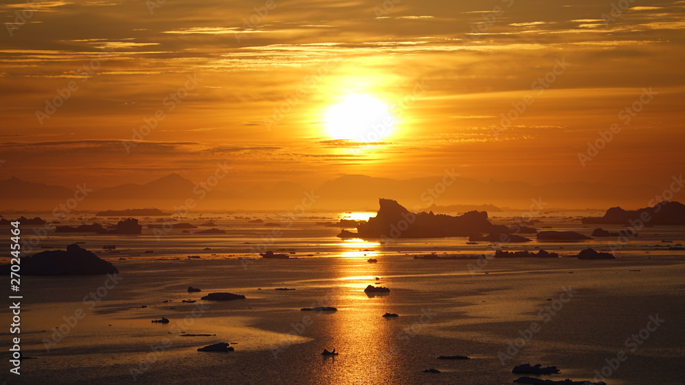 Fototapeta premium Sunset on icebergs in Arctic Ocean