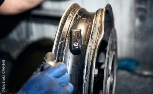 Repair and maintenance of motorcycle wheels on the service. © trek6500