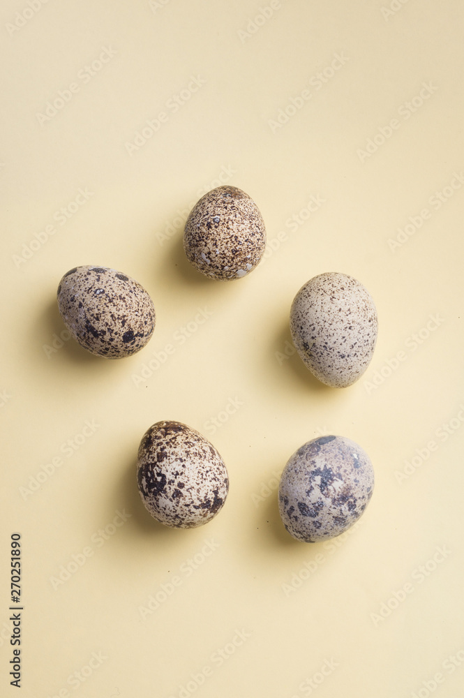 heap of quail eggs on color background. Vegetarian organic eco food. Top view. flatlay heap of quail eggs on color background. Vegetarian organic eco food. Top view. flatlay