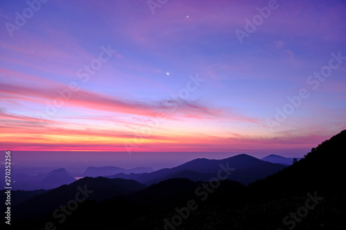 Twilight light pink and purple colors beautifully. reflect the views Mountains and fog in the morning. Khao Jed Yod, Trang in Thailand.