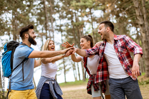 Group of four friends hikin...