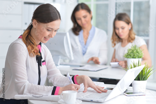 Portrait of young women working in modern office