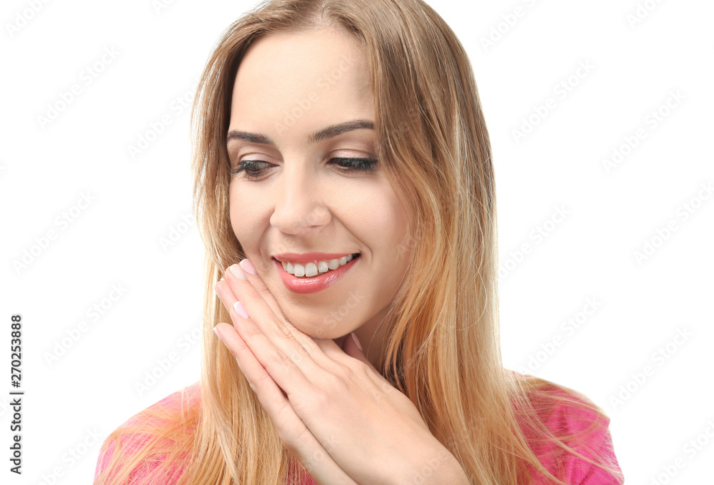Beautiful smiling woman posing against white background